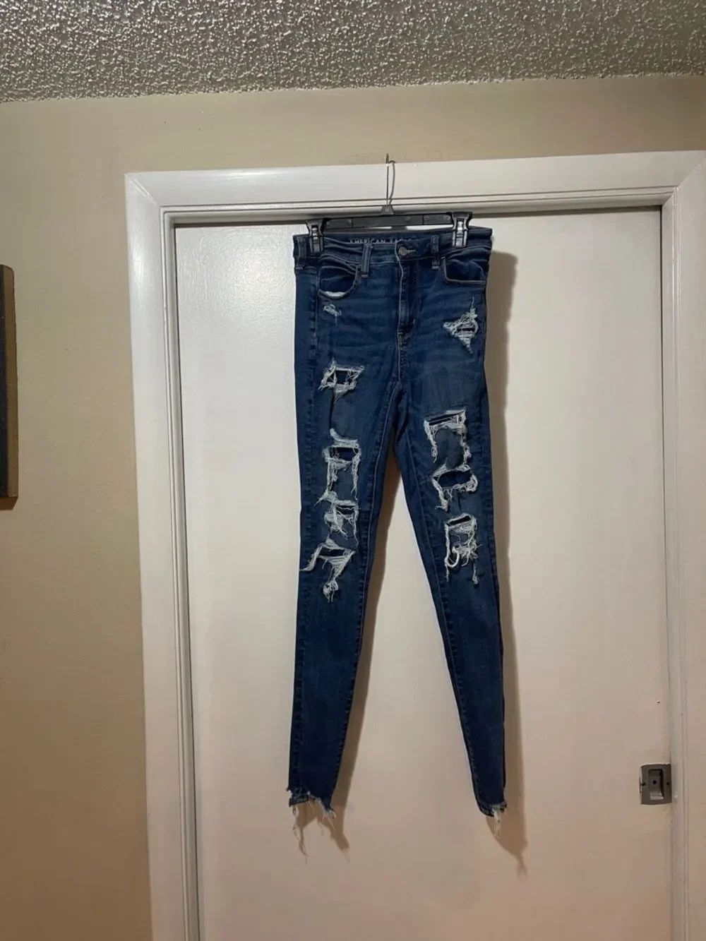 American Eagle Outfitters Dark Blue high-rise, distressed, jeggings size 4 long
